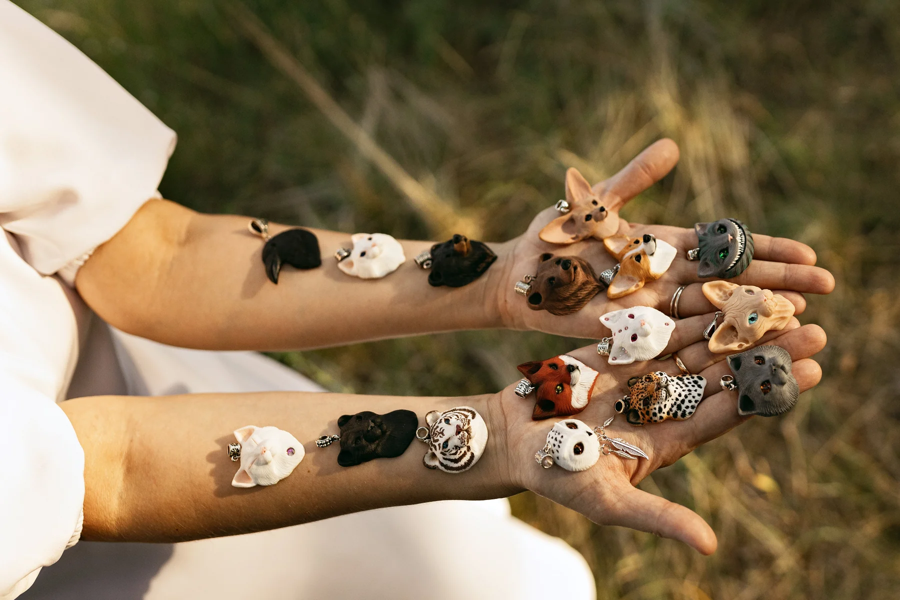 The maker’s hands holding handmade jewellery